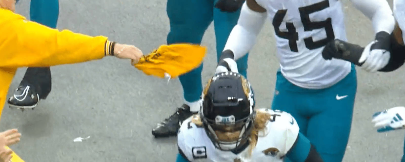 Steelers fan smacks Jags player who stole his terrible towel! 