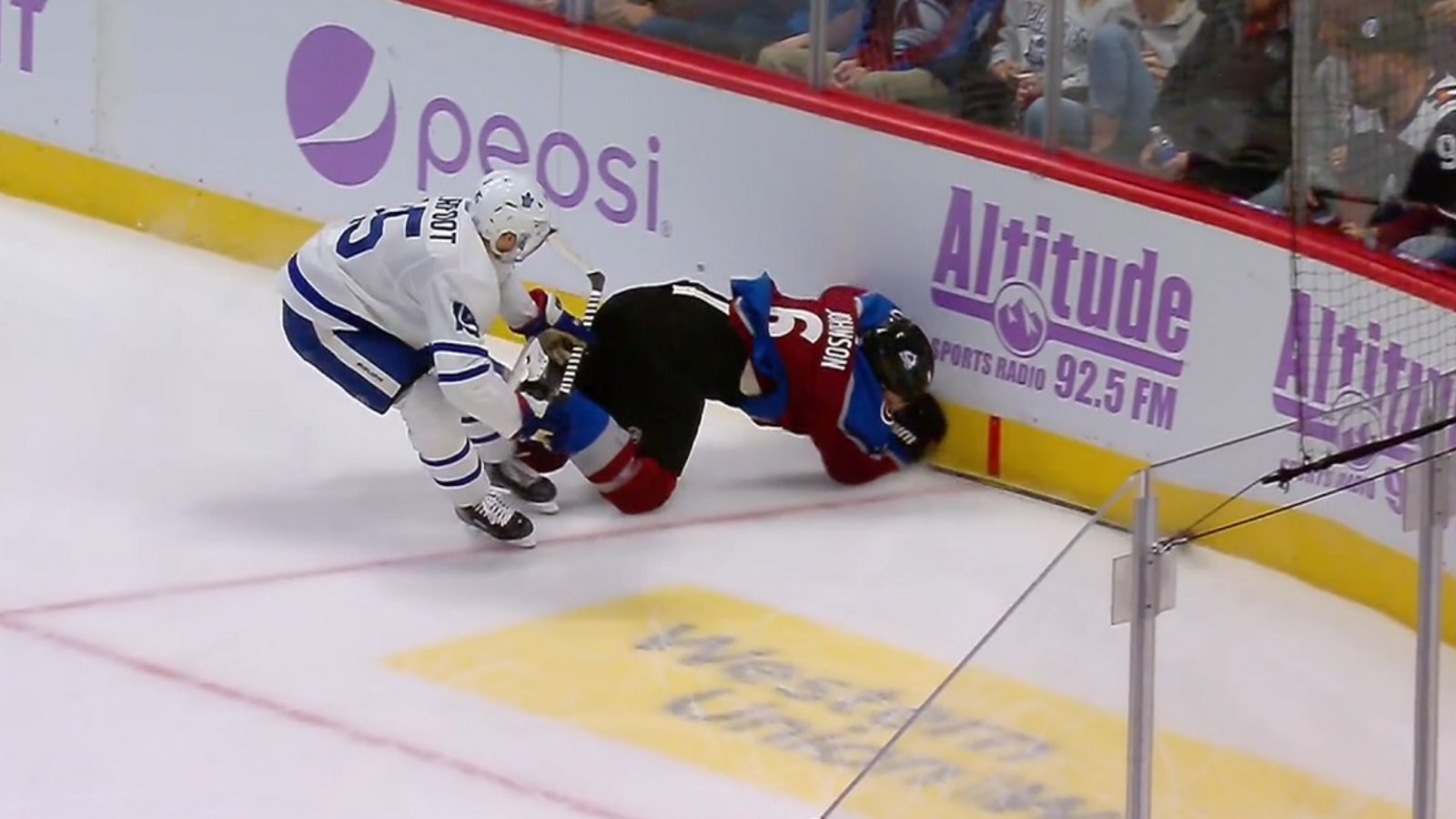 Alex Kerfoot sends Erik Johnson head first into the boards.