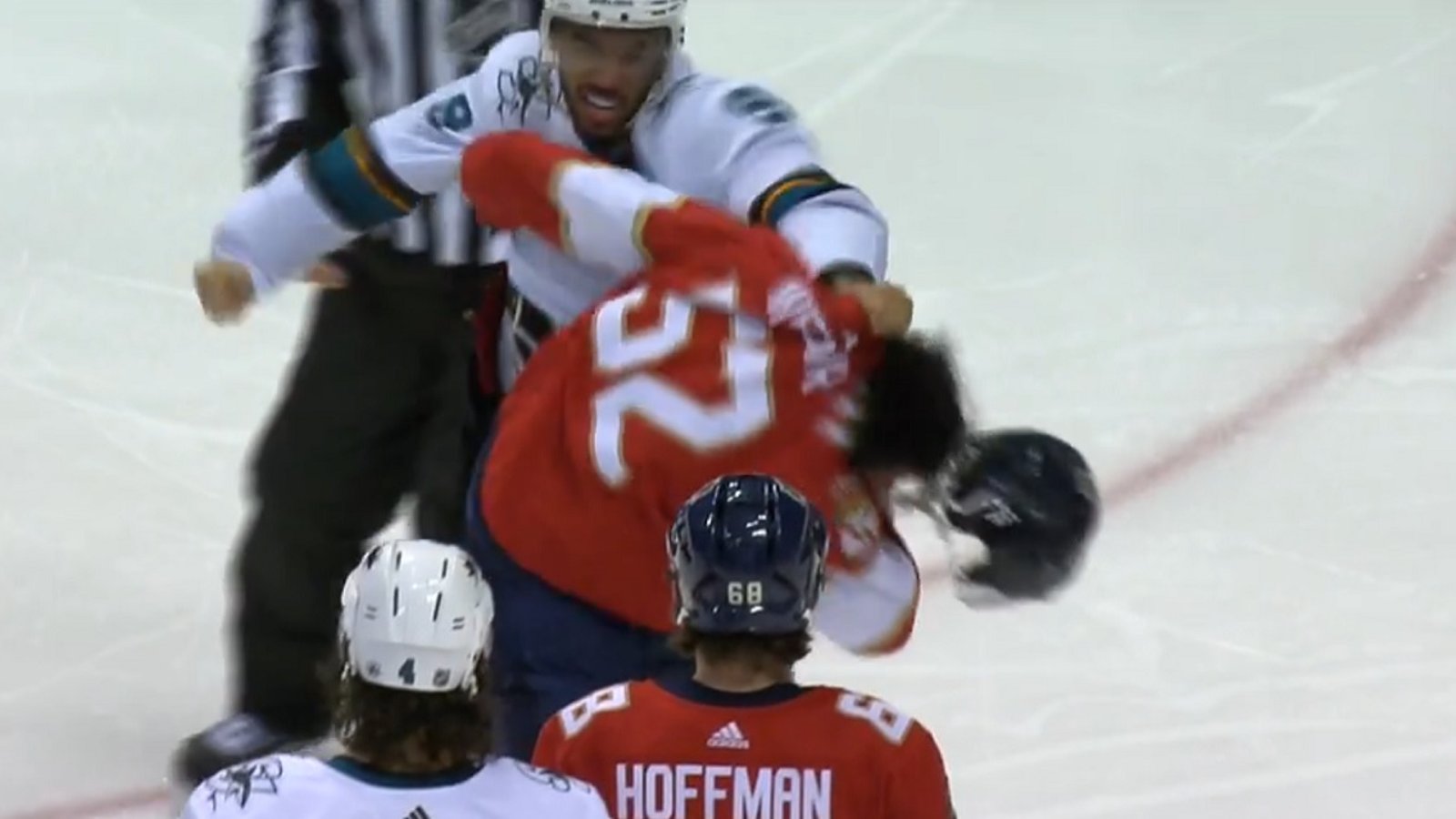 Evander Kane goes after MacKenzie Weegar after a big hit from Weegar.