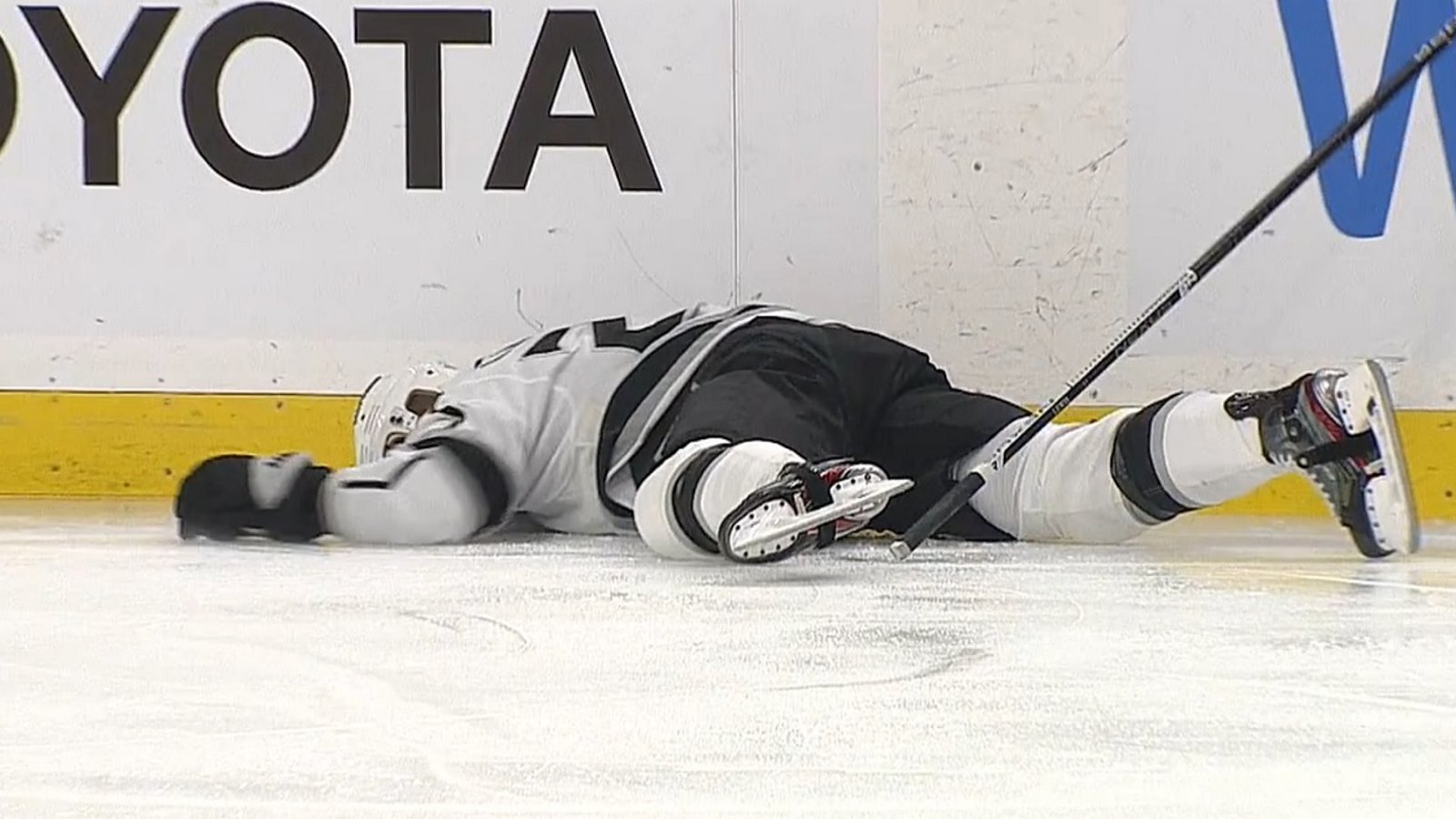 Trevor Lewis knocked out after brutal collision with Rasmus Asplund.