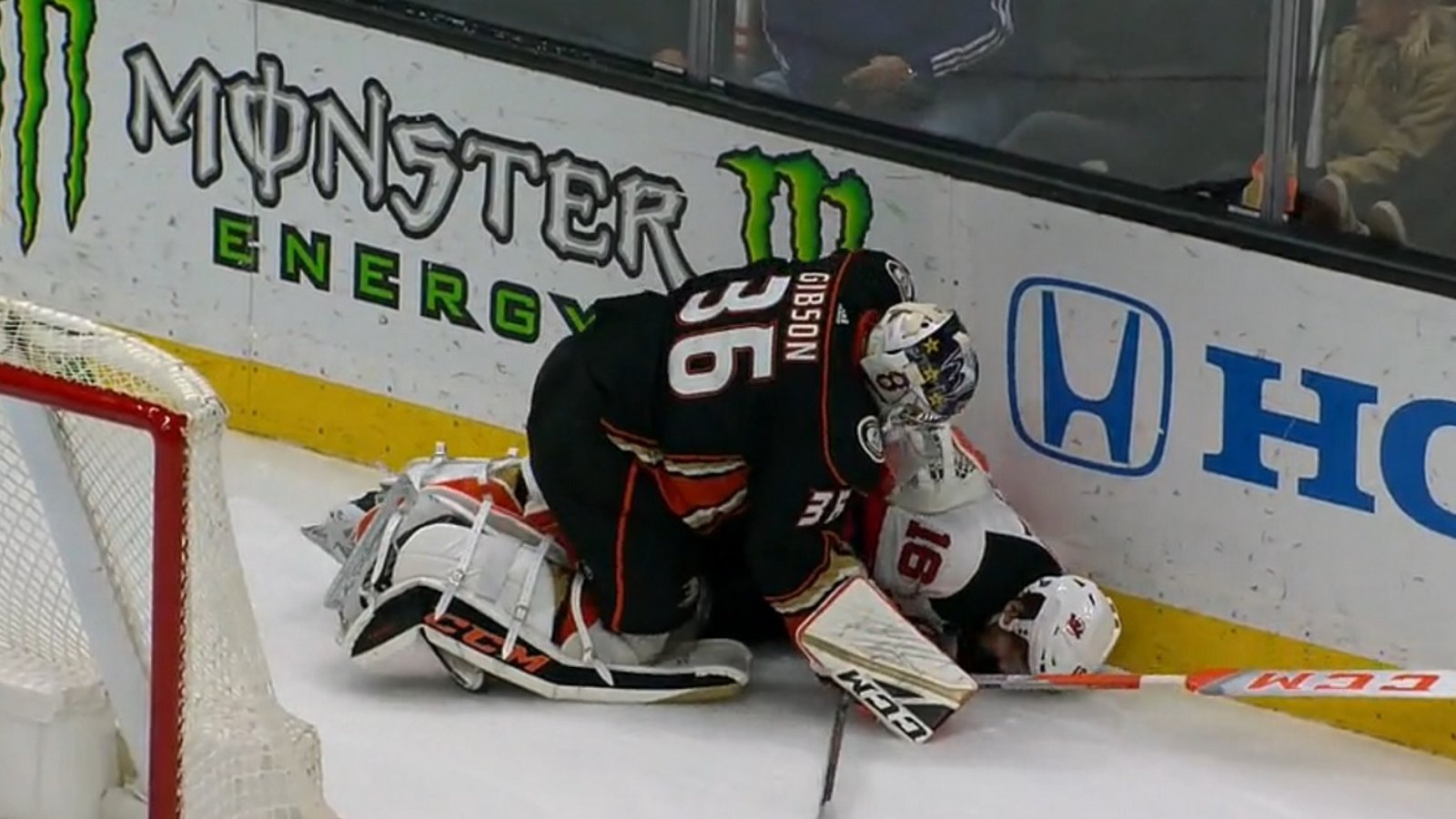 Ducks goalie John Gibson levels Kevin Rooney and then adds some trash talk for good measure.