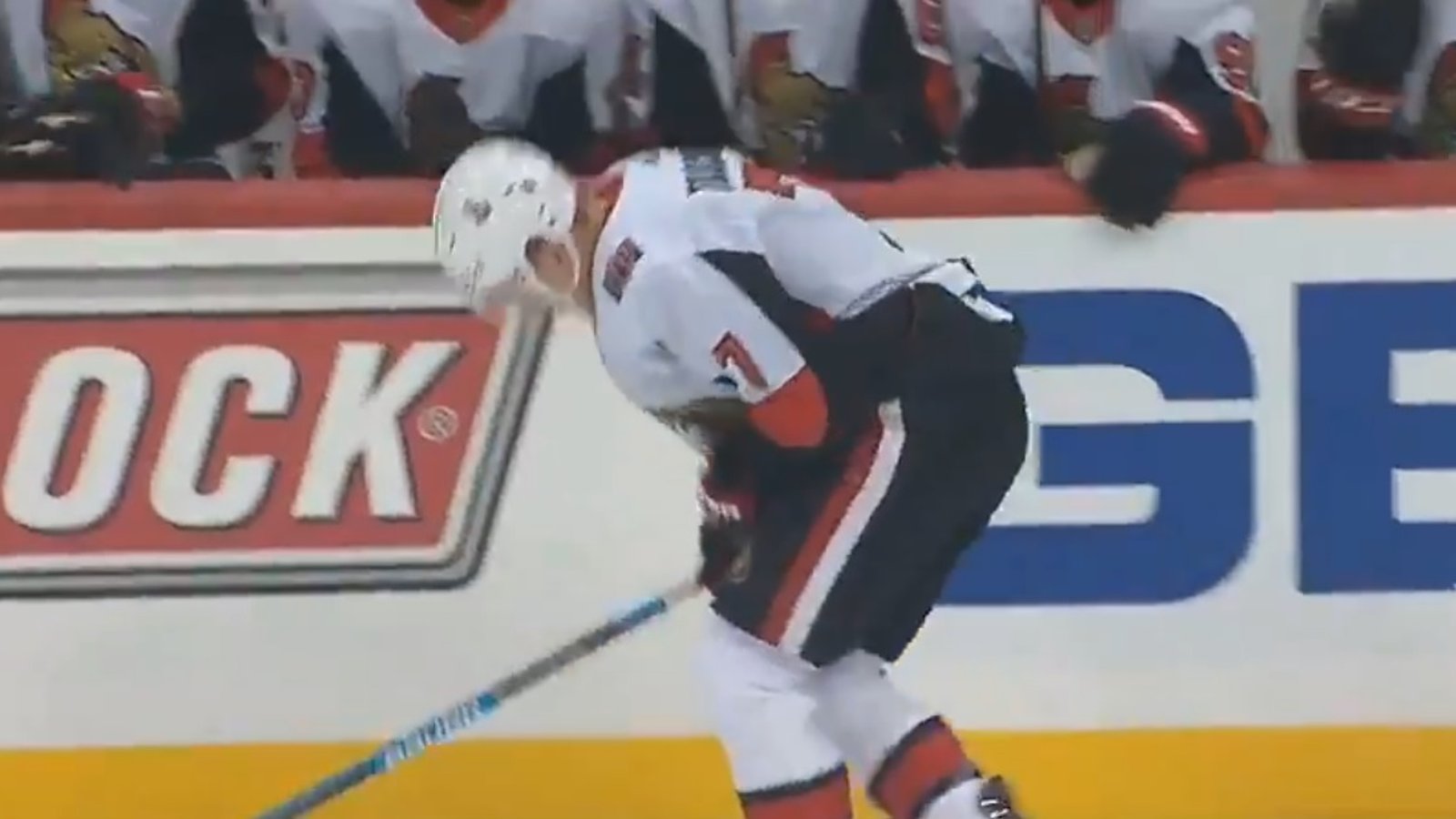 Brady Tkachuk hurts himself while trying to crosscheck Jake Guentzel.