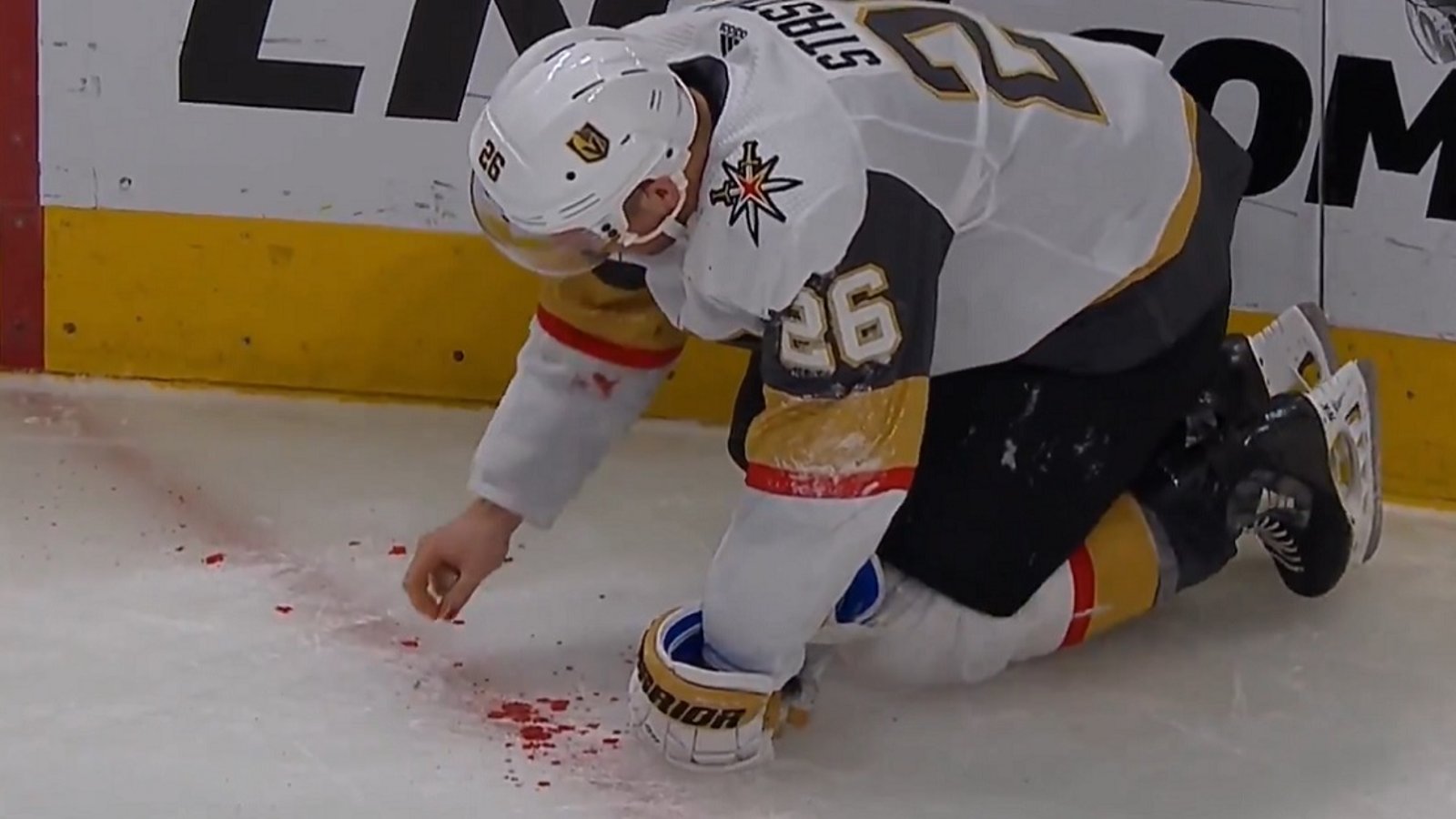 Paul Stastny forced to pick his teeth up off the ice after taking a wicked shot to the face.