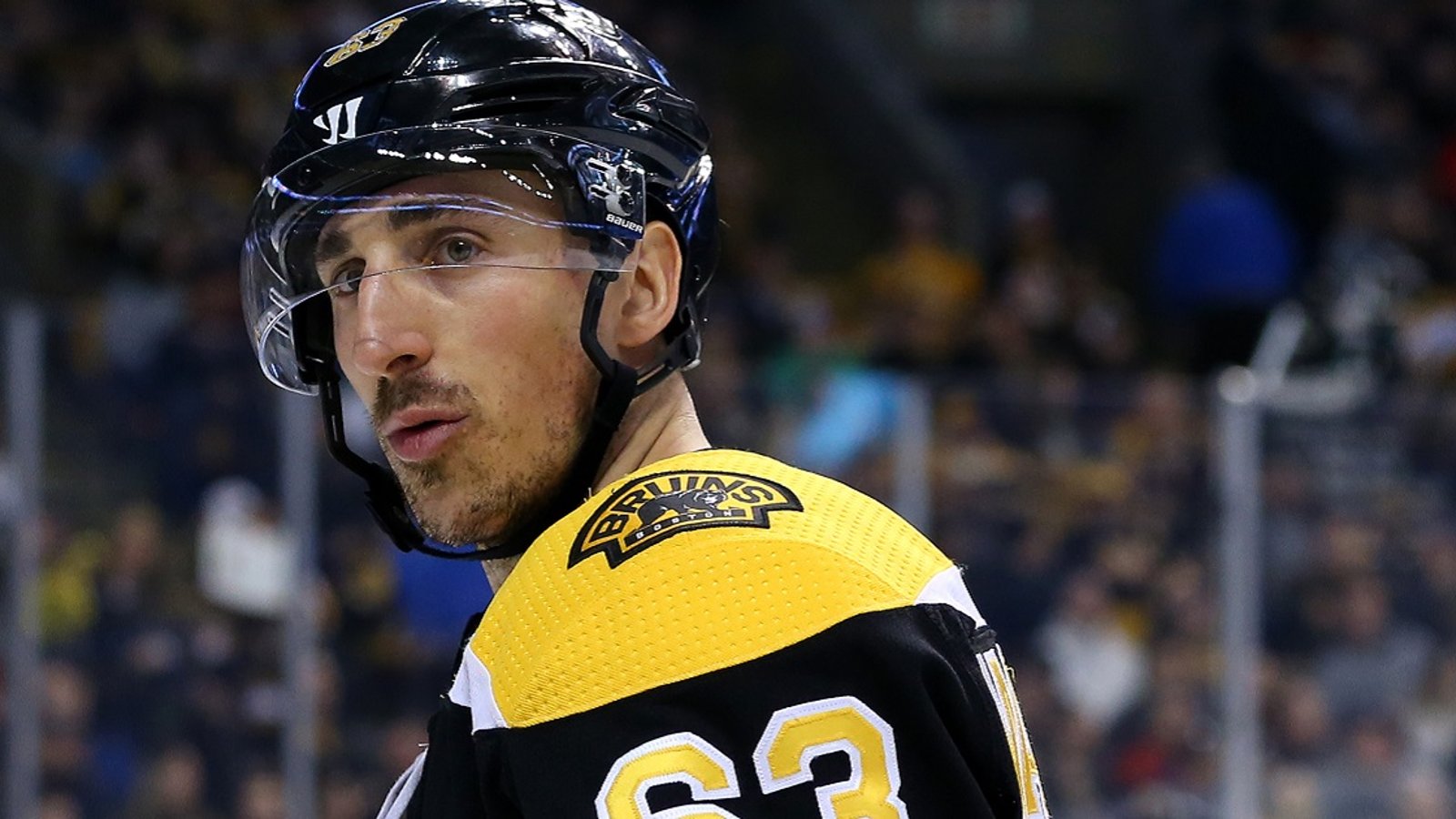 Brad Marchand cross checks Ty Smith in the head.
