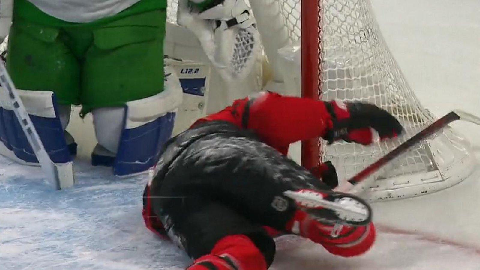 Mitch Marner sends Brady Tkachuk into the goalpost, nearly head first.