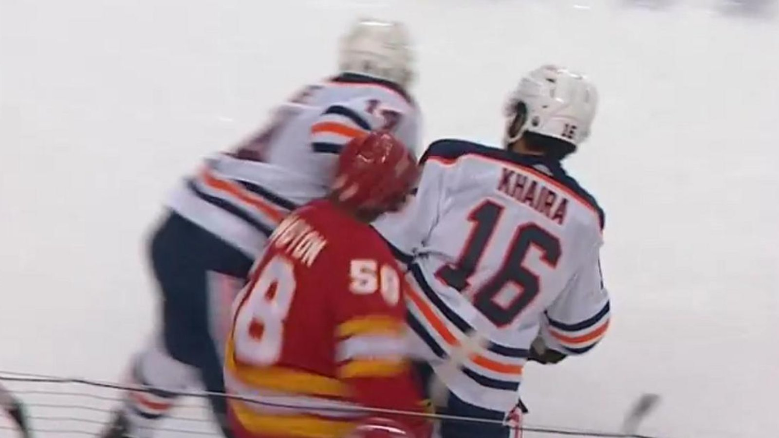 Jujhar Khaira takes out Oliver Kylington with a big hit to the head.