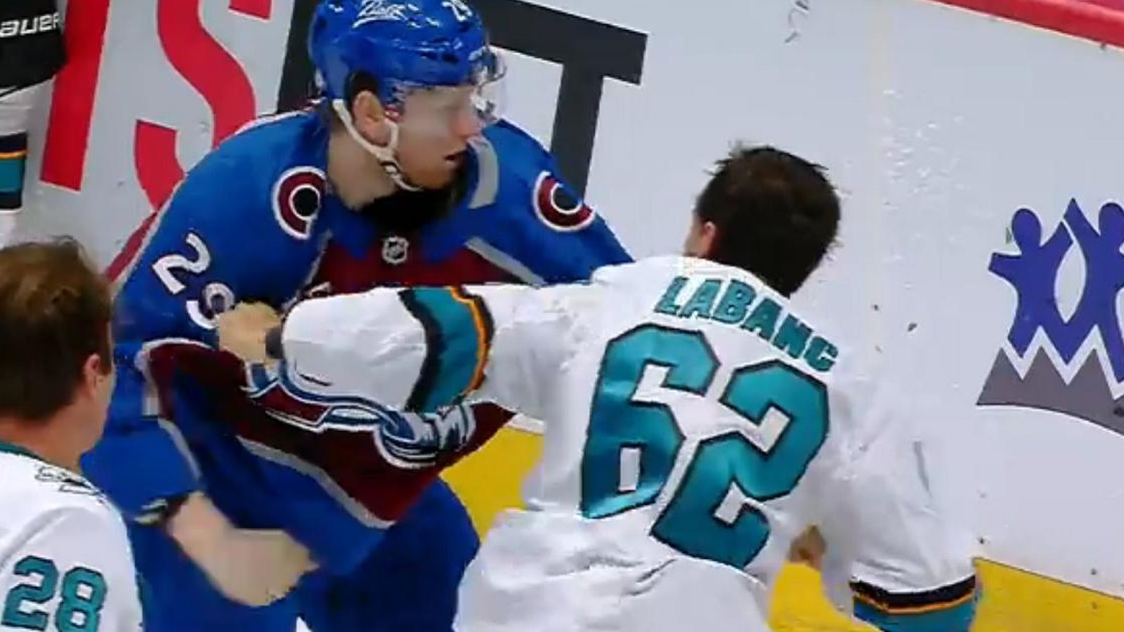 Nathan MacKinnon drops the gloves with Kevin Labanc in the third.