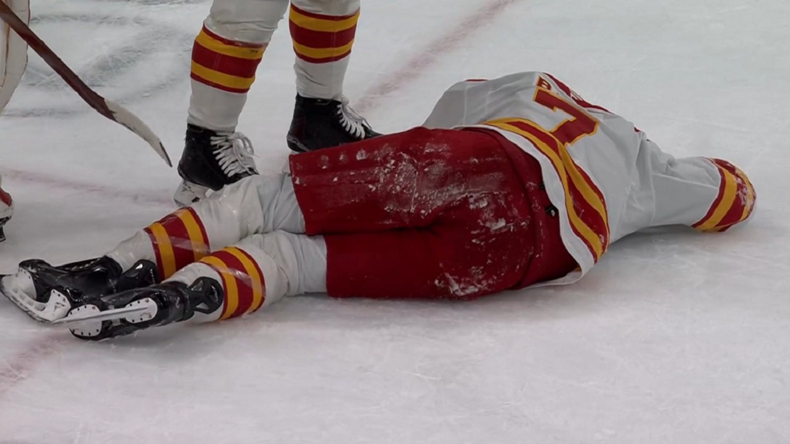 Kevin Bahl goes down after taking a puck to the back of the head.