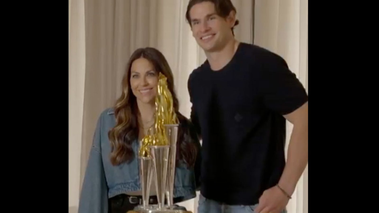 Johnny Gaudreau’s wife, Meredith, surprises Sean Monahan with the Bill Masterton Memorial Trophy