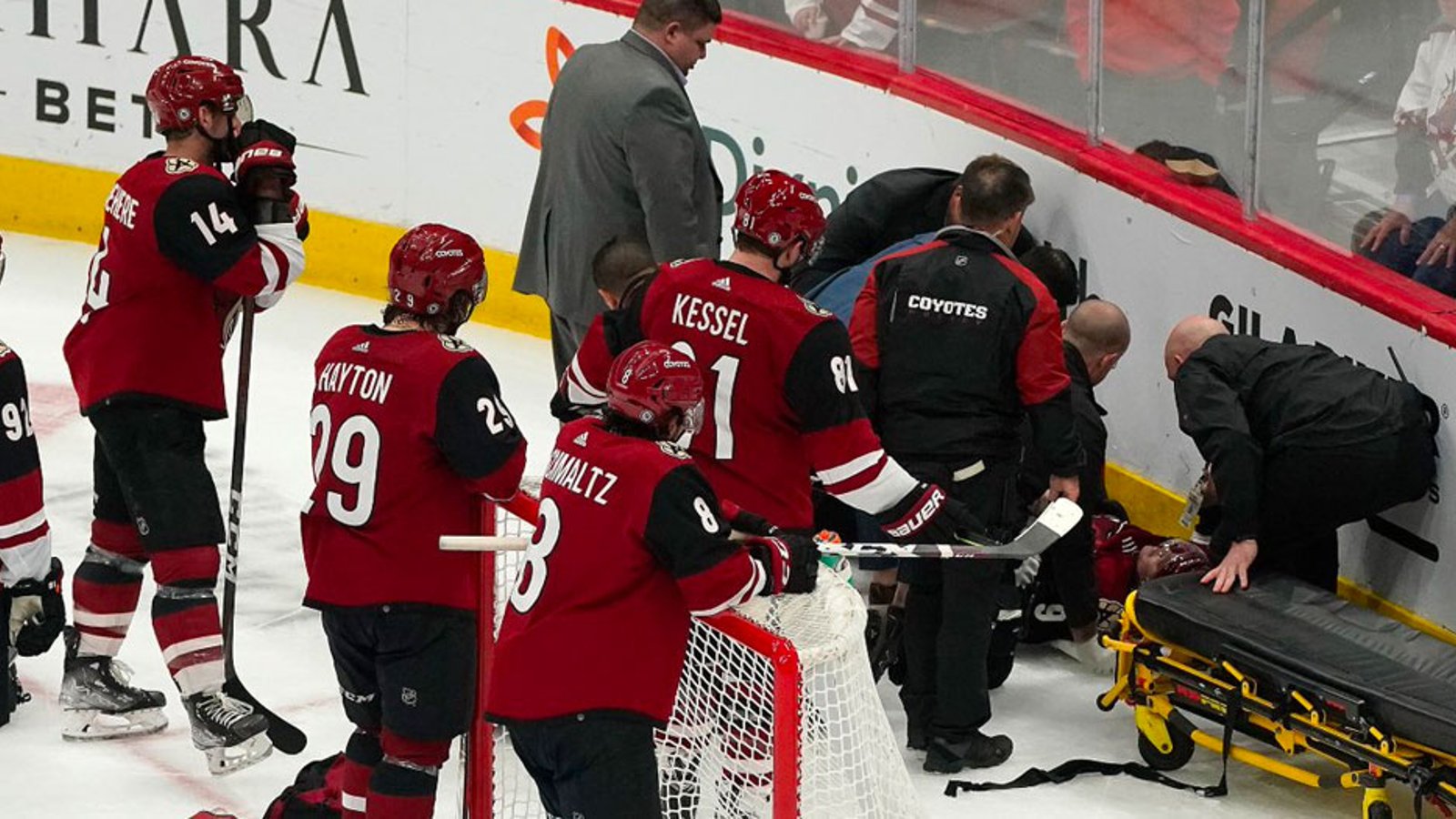 Coyotes forward Clayton Keller leaves on a stretcher after horrific fall into end boards