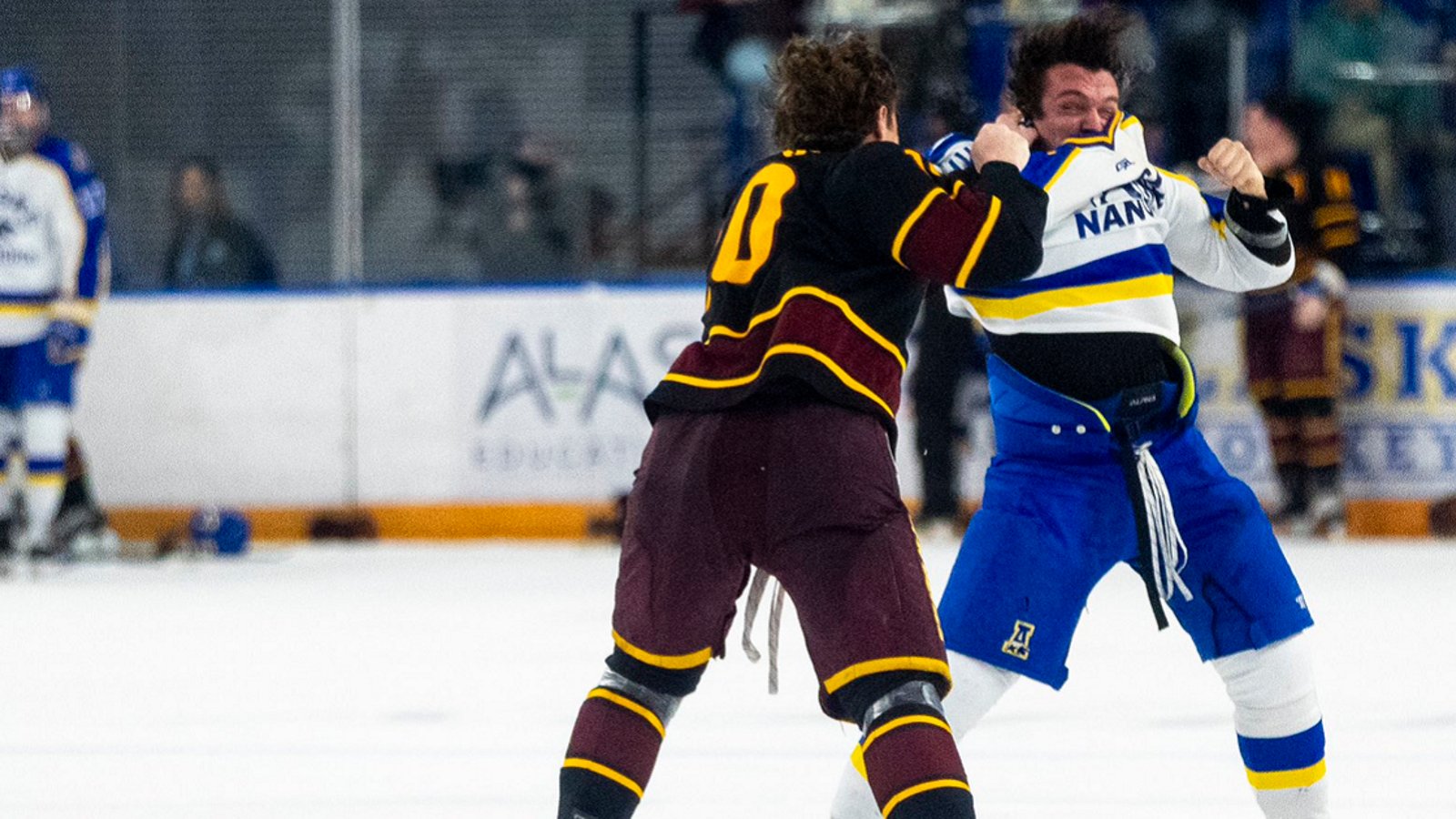 Brutal clash at center ice after 2 players leave the penalty box.