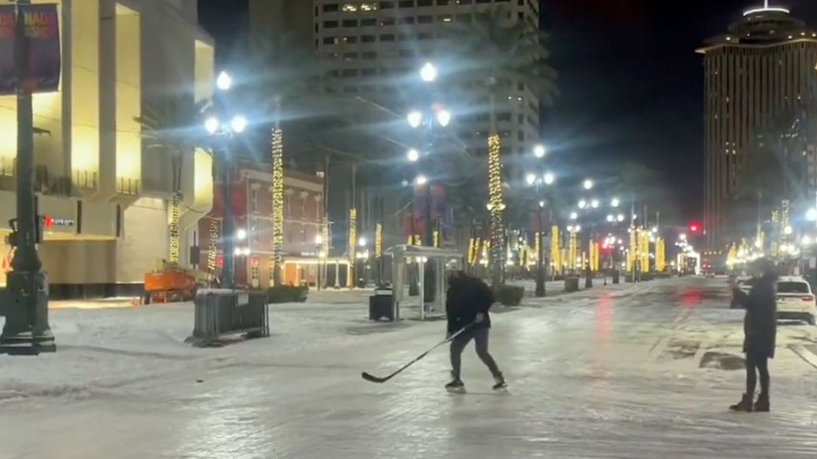 It's so cold in New Orleans that people are playing hockey on Bourbon St.