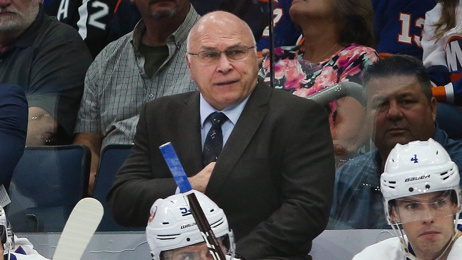 Barry Trotz loses his cool, throws a stick out onto the ice.