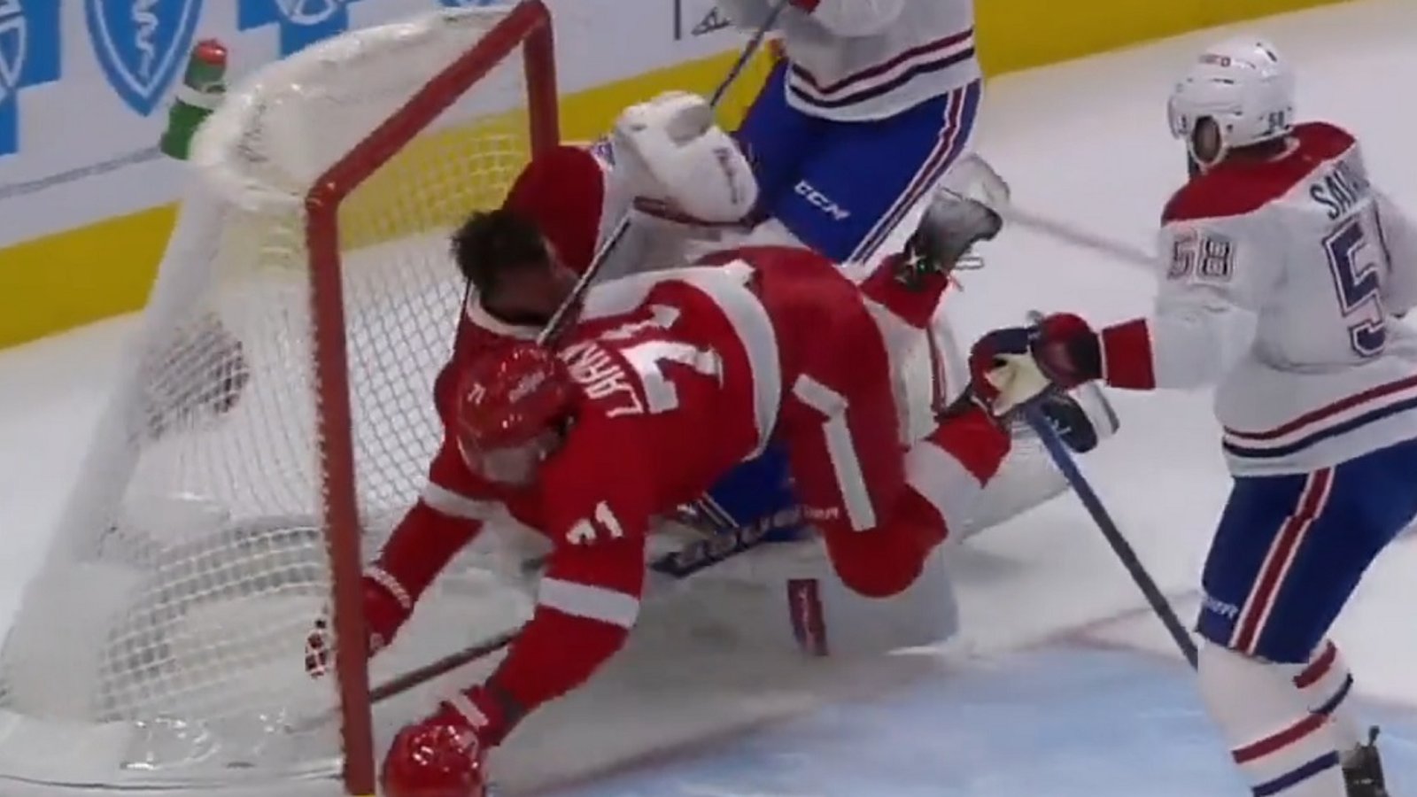 Dylan Larkin crashes into Jake Allen, knocking him out of the game.