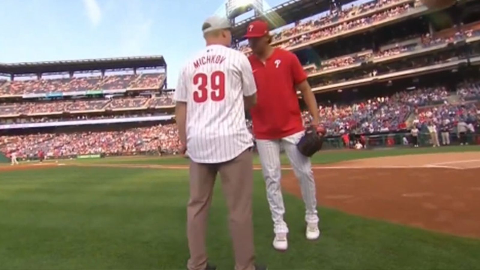 Matvei Michkov throws out the first pitch for the Phillies