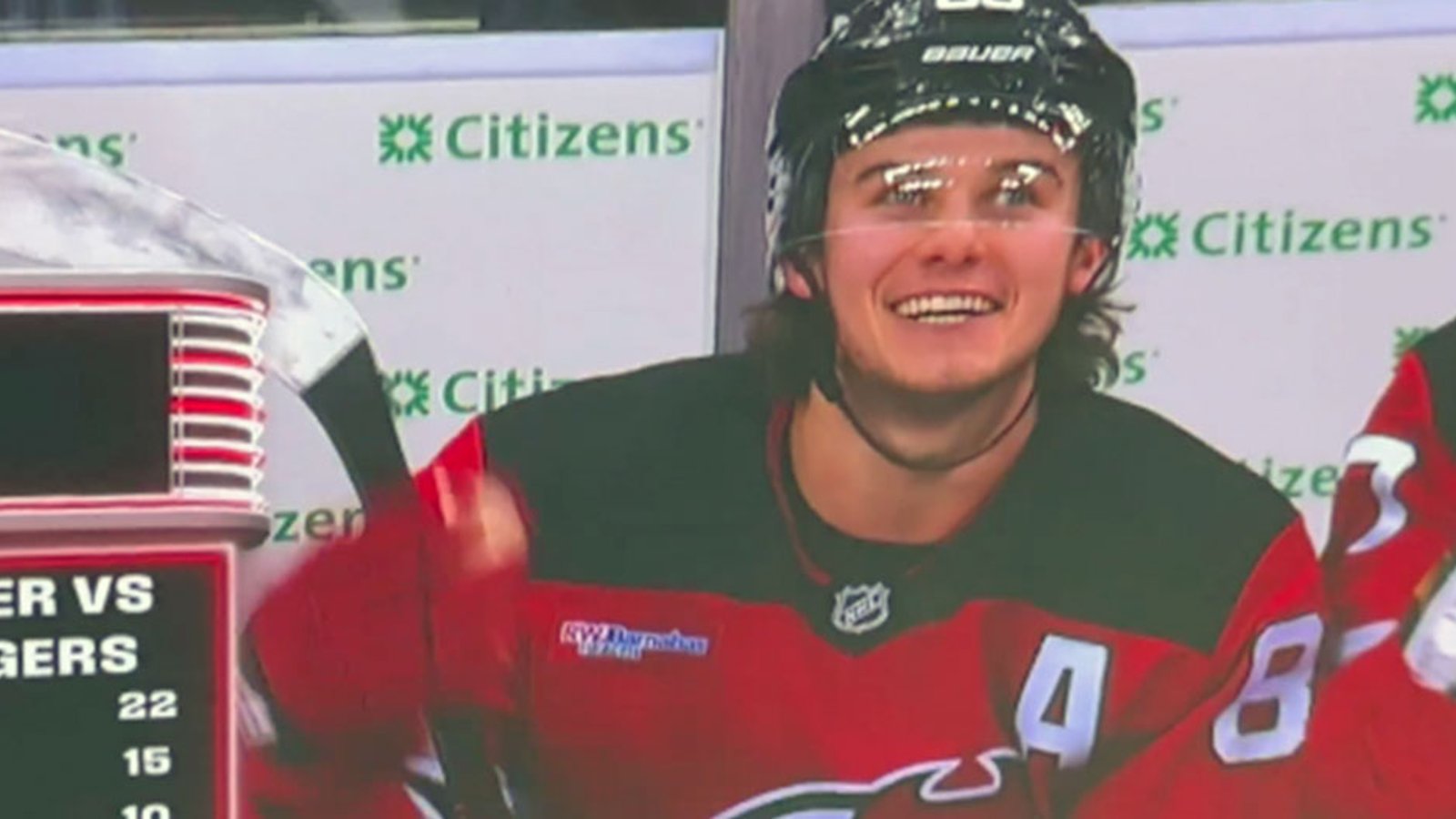 Devils jumbo-screen mocks Rangers' fans and cameras catch Jack Hughes laughing out loud