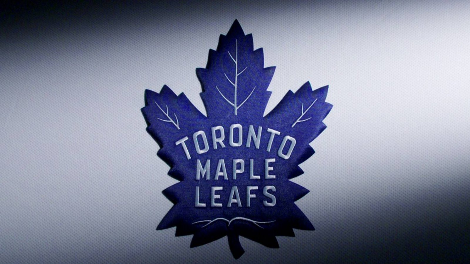 Maple Leaf heads to the locker room during the first period.
