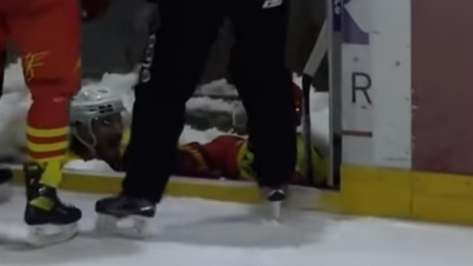 Body check lands 2 players in the Zamboni's ice pit.