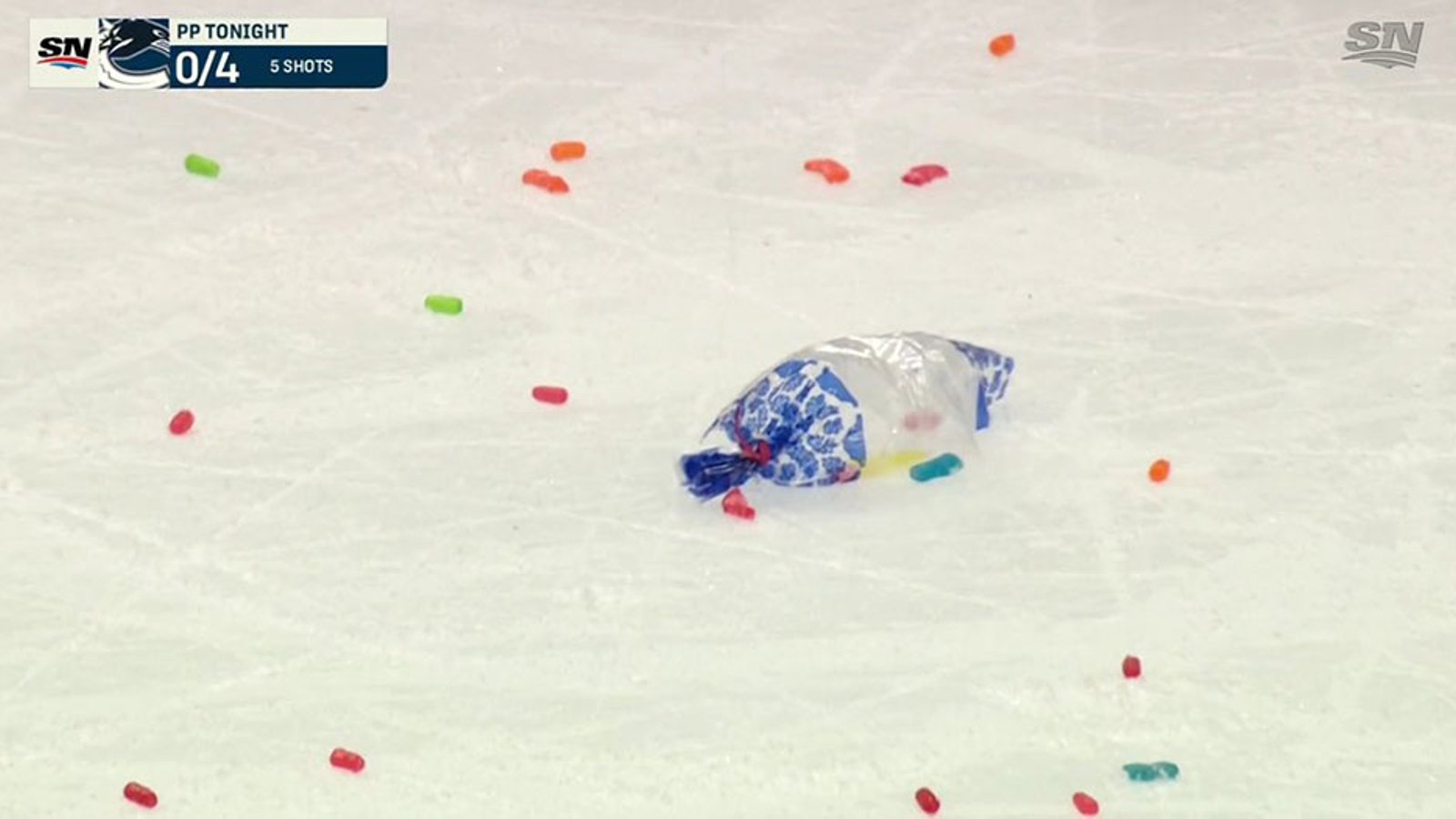 Avs fan hits Elias Pettersson with a bag of candy during face-off