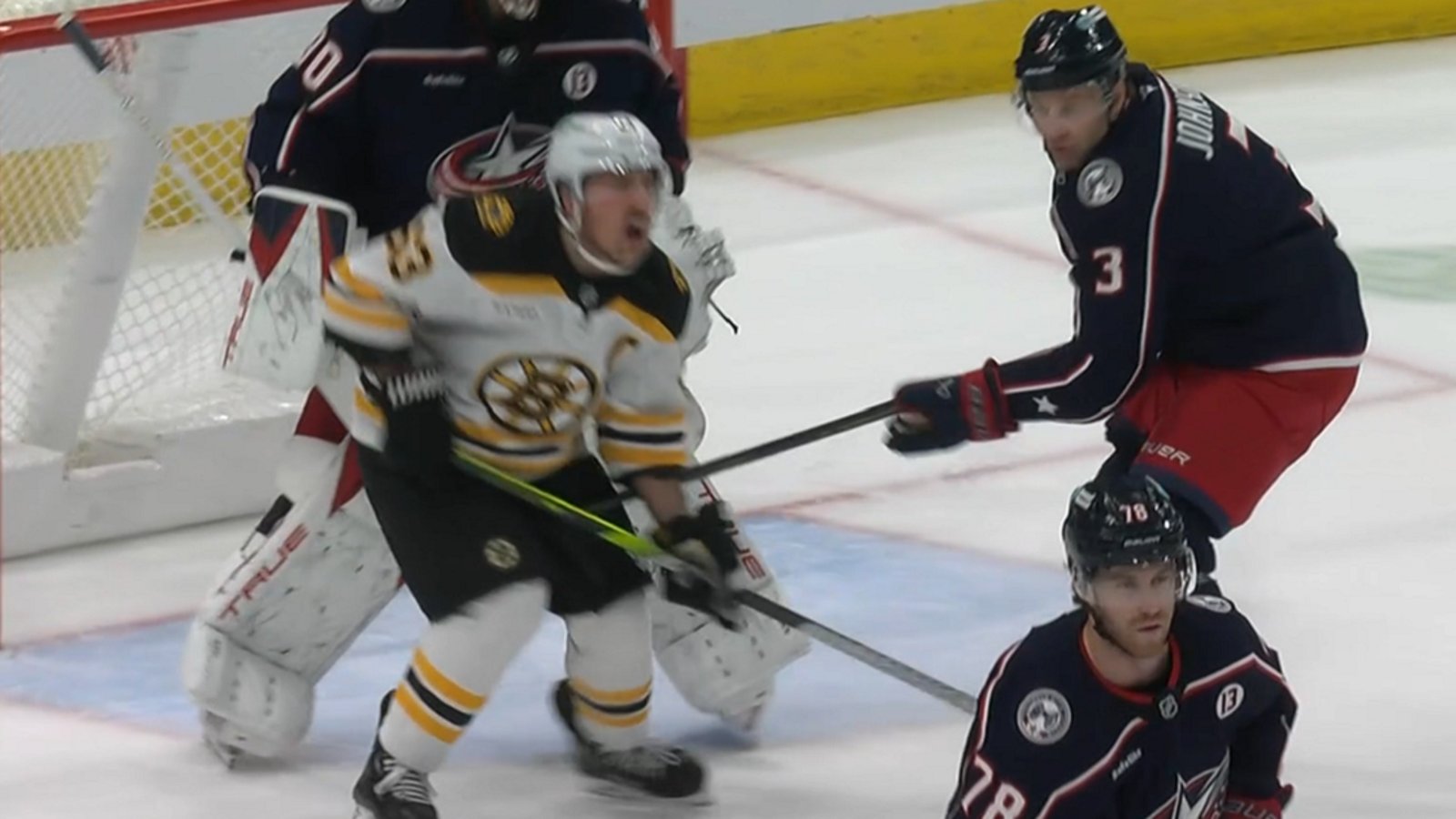 Brad Marchand goes down after blatant low blow.