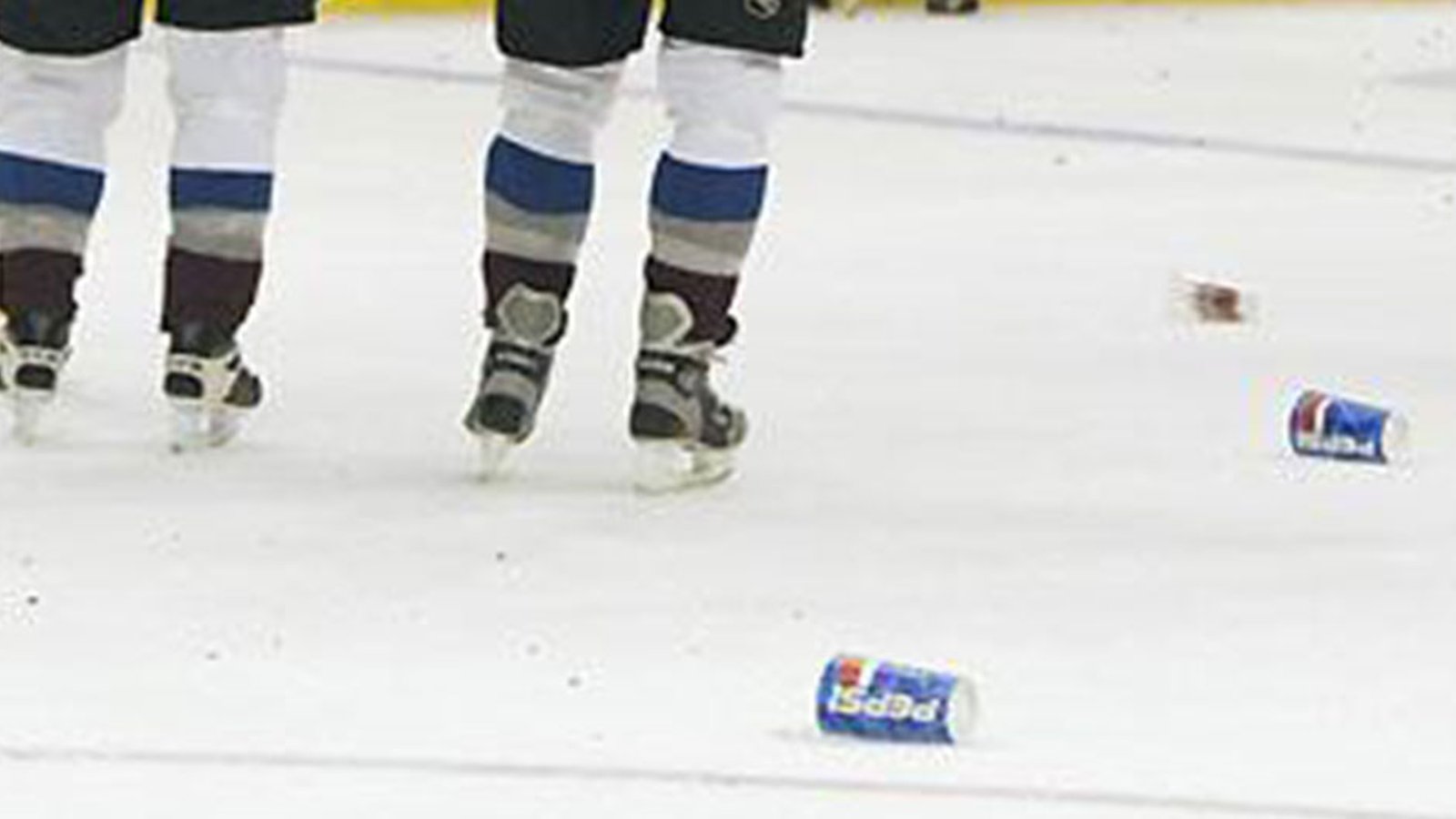 Players pelted with beer cans and garbage in two separate incidents in the NHL last night