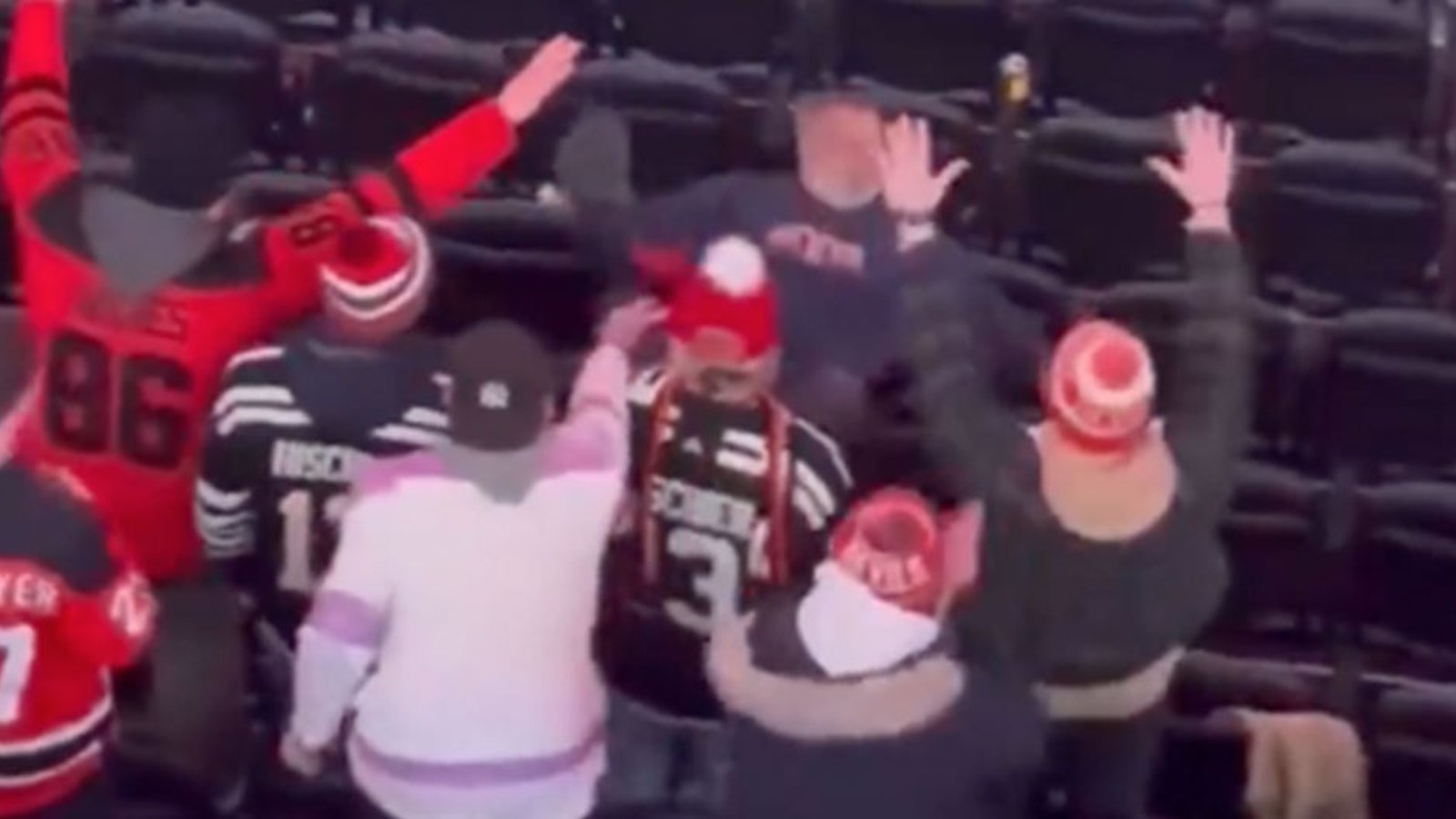 Drunken Rangers fan makes a fool of himself trying to fight Devils fans