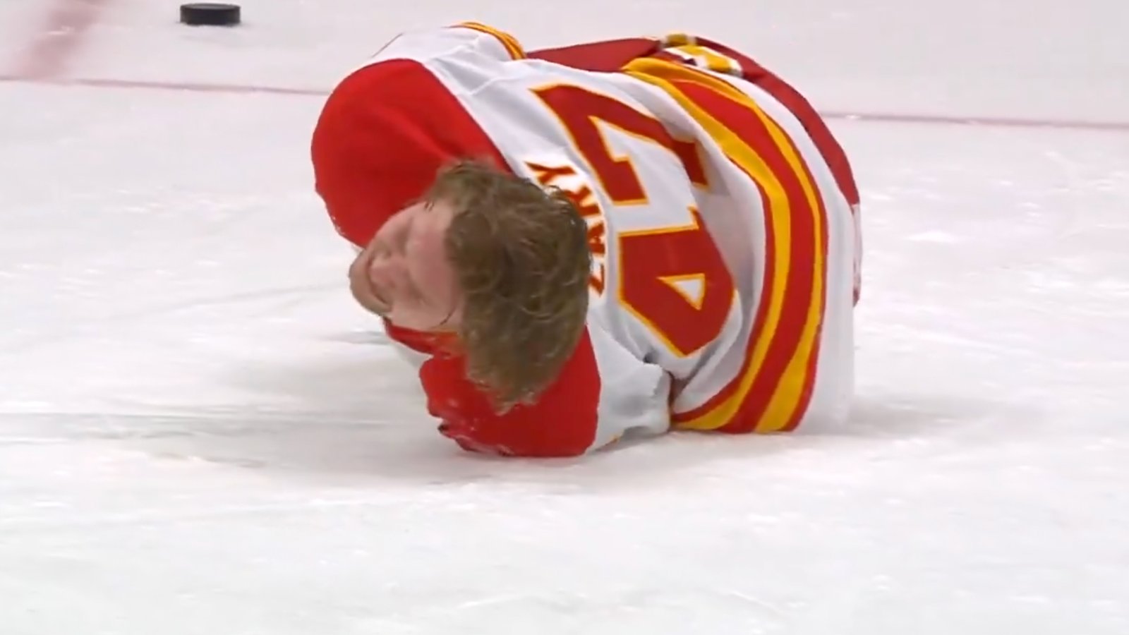 Flames’ Connor Zary suffers most gruesome knee-on-knee injury in front of his mother