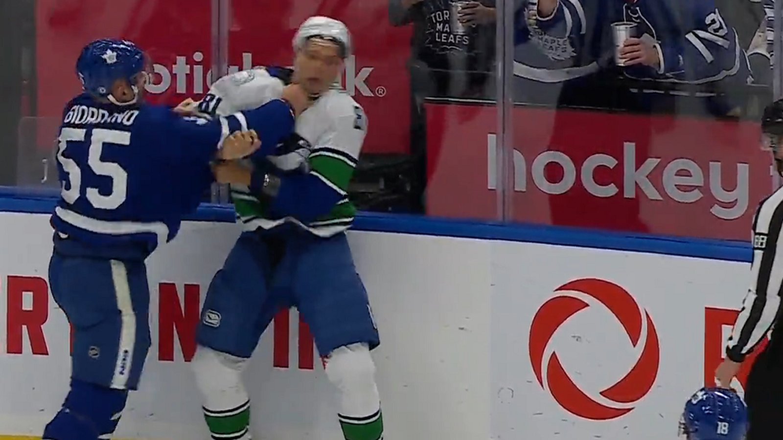 Mark Giordano drops the gloves with Dakota Joshua.