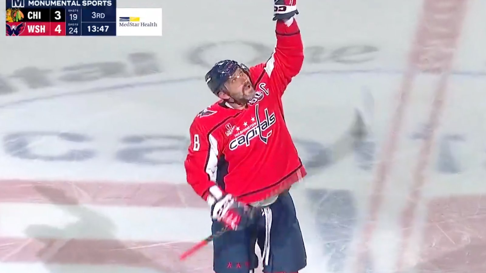 An emotional Alex Ovechkin celebrates on the ice after tying Wayne Gretzky’s record