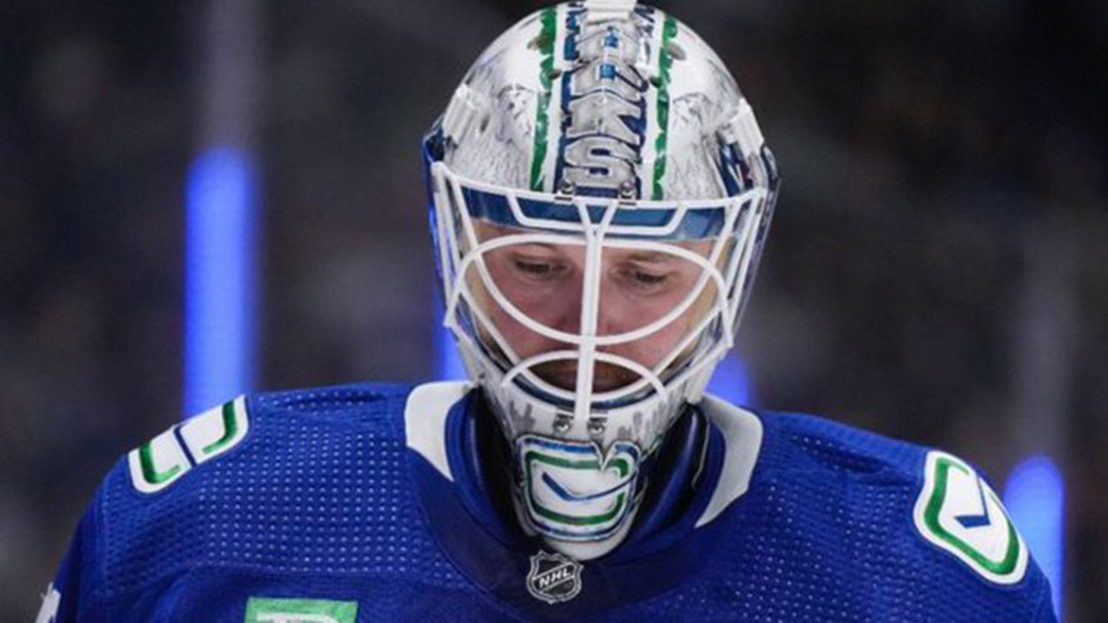 Canucks goalie Thatcher Demko pukes in his own mask during play