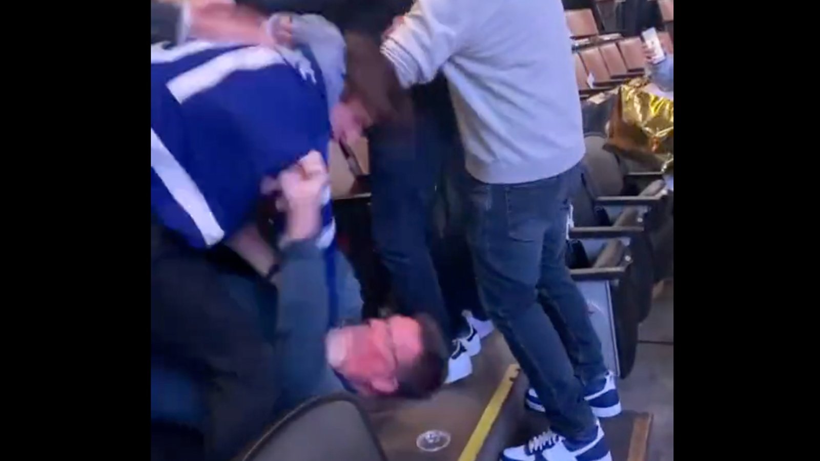 Leafs’ fan gets clobbered after allegedly putting his hands on a woman in the stands!