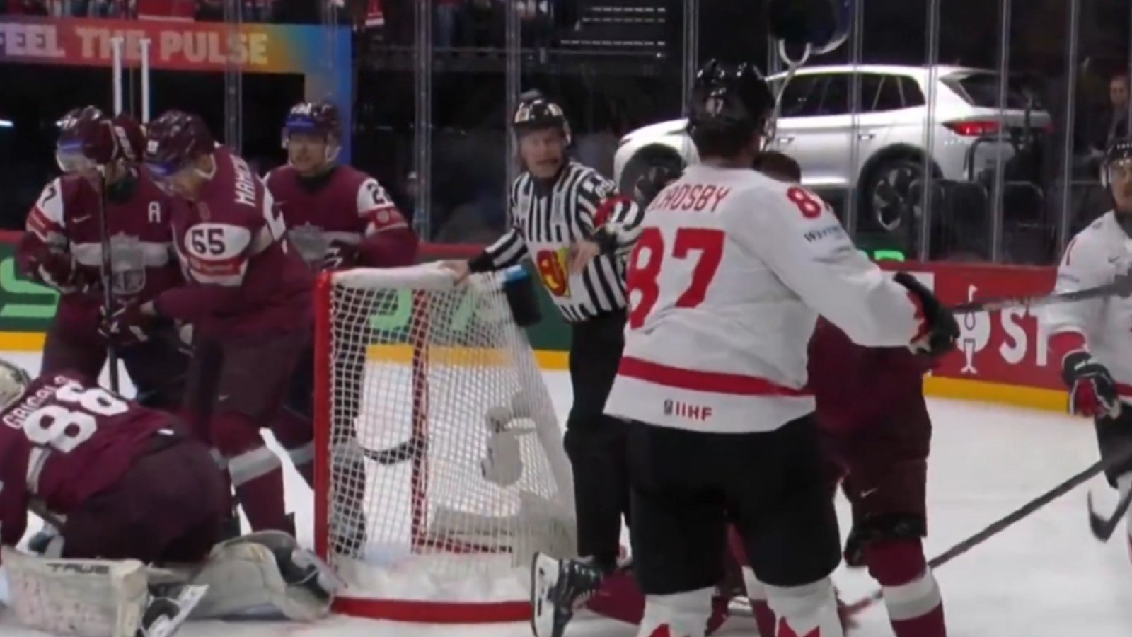 Sidney Crosby punches a players helmet off at World Championship.
