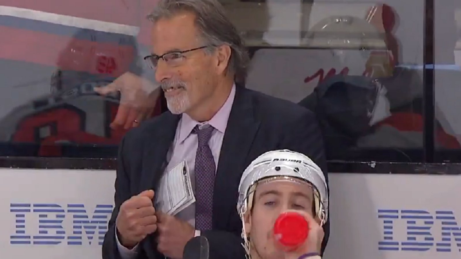 Cole Caufield makes John Tortorella crack a smile.