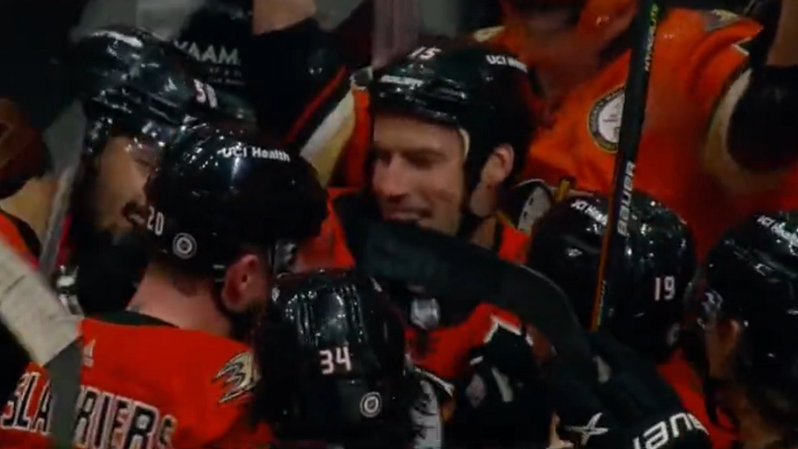 Ryan Getzlaf is mobbed after making NHL history.