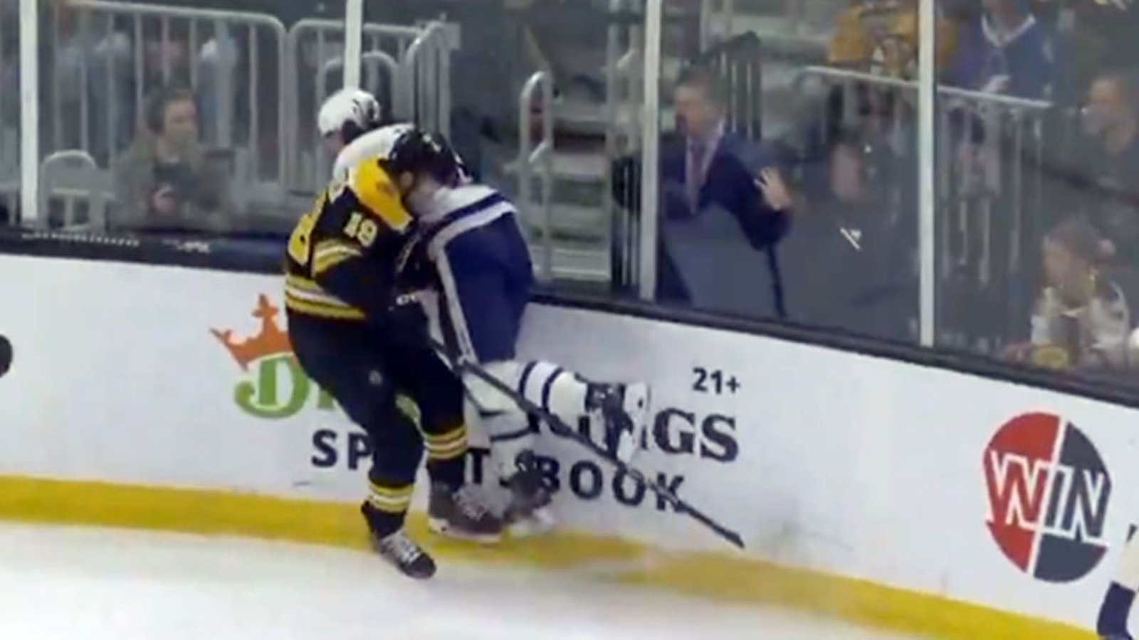 Chris Tanev takes a huge hit from Beecher, leaves the game with injury