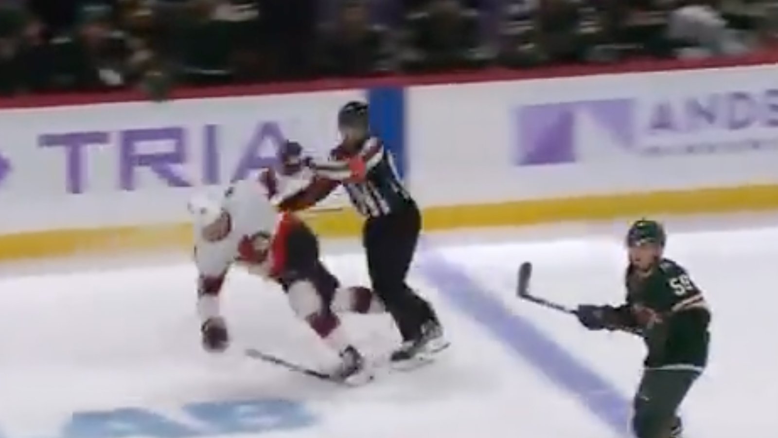 Referee shoves Tim Stützle over causing him to be offside on the play