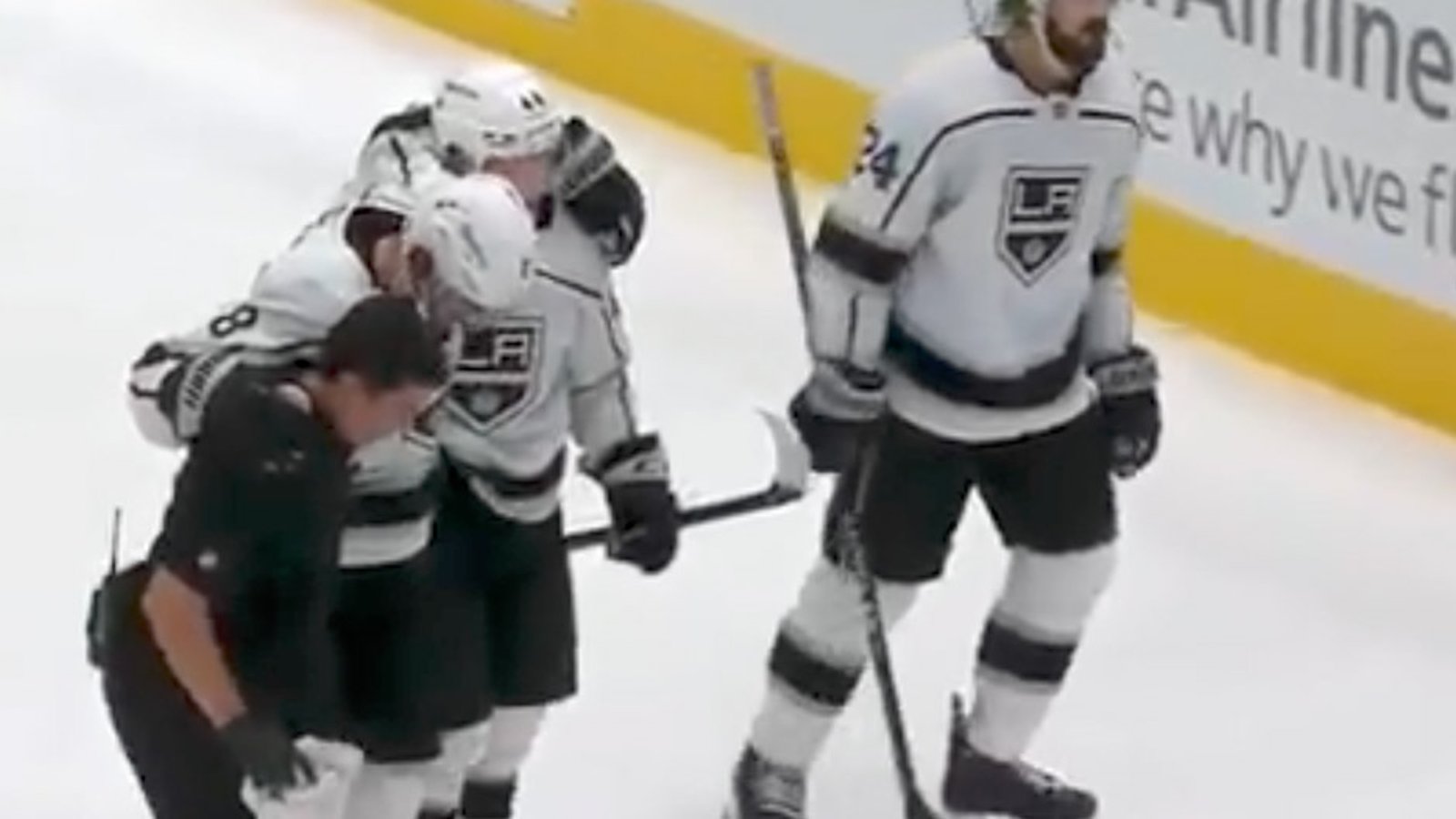 Drew Doughty helped off the ice after taking DIRTY knee on knee hit! 