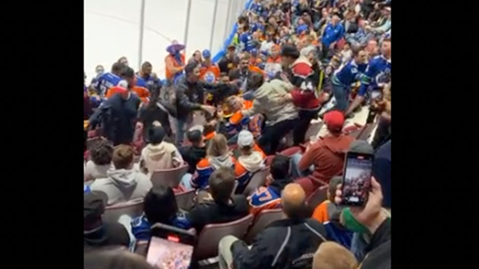 Oilers fan tries to fight Canucks fans in the stands last night