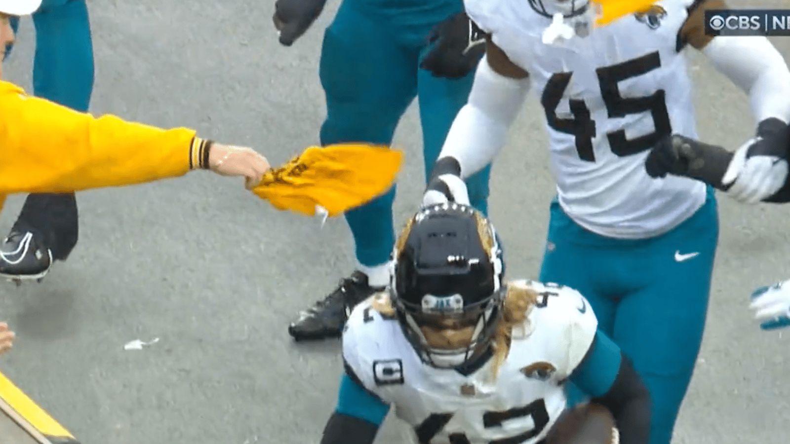 Steelers fan smacks Jags player who stole his terrible towel! 