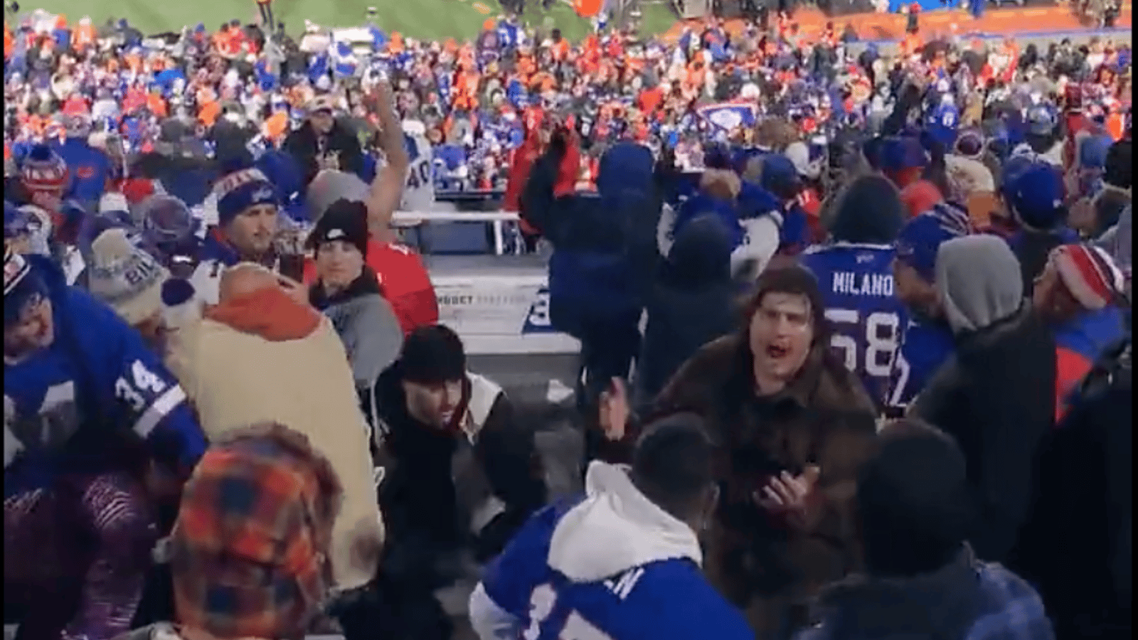 Bills fans brawl in the stands with one another! 