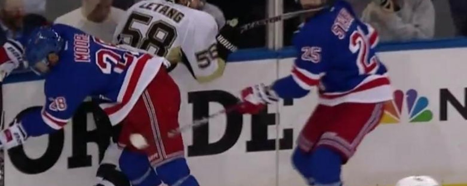 Kris Letang delivers a hard slash to the face of his opponent.