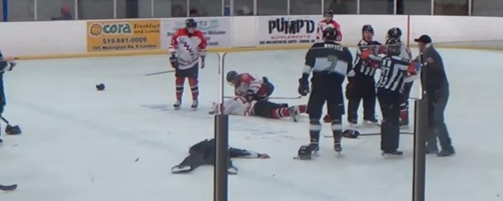 Referee loses his cool, punches player, trainer jumps off bench, attacks referee.
