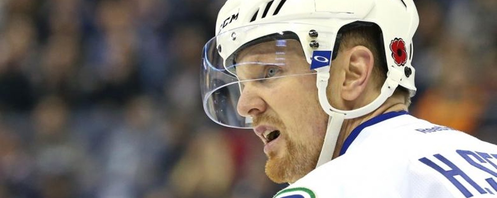Canucks star Sedin injured after hit from behind.