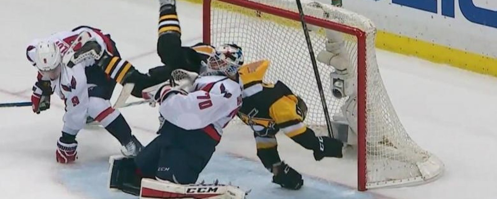 Hit on Hagelin sends him flying into Braden Holtby.