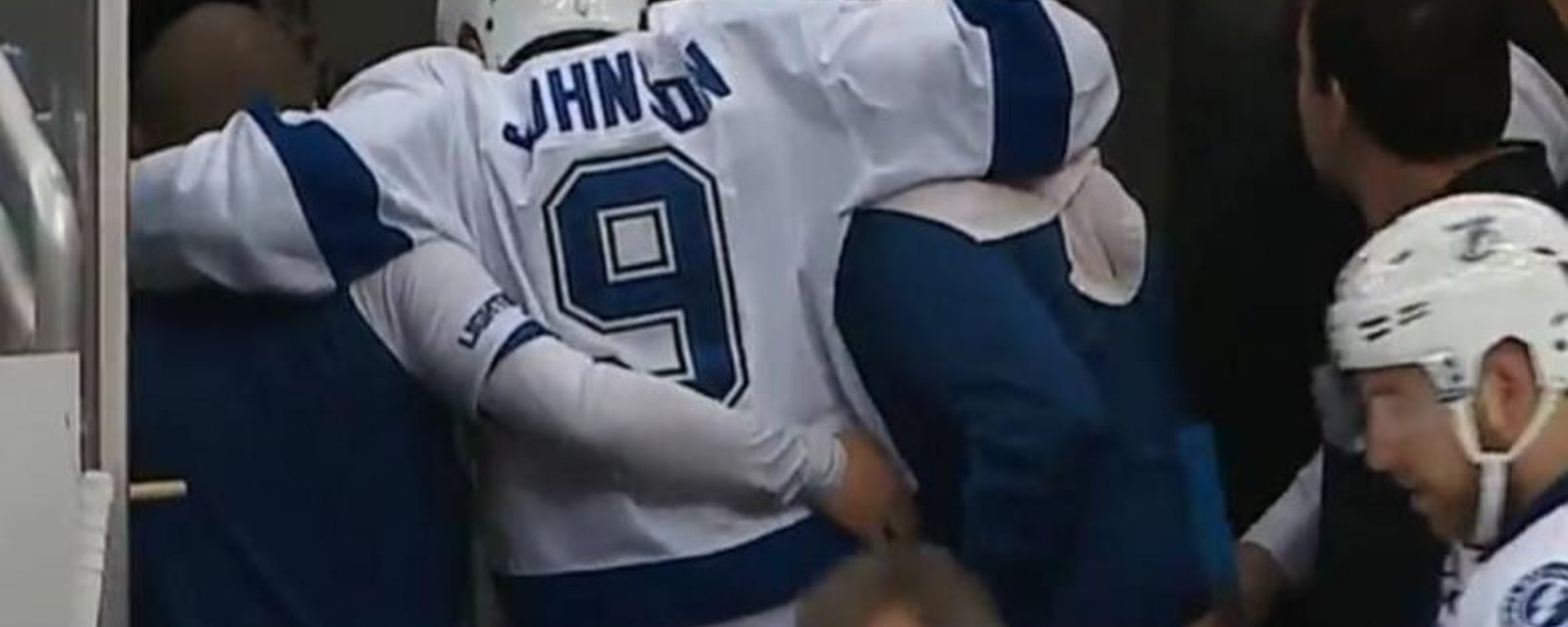 Tyler Johnson reacts awkwardly to incoming hit and gets injured.