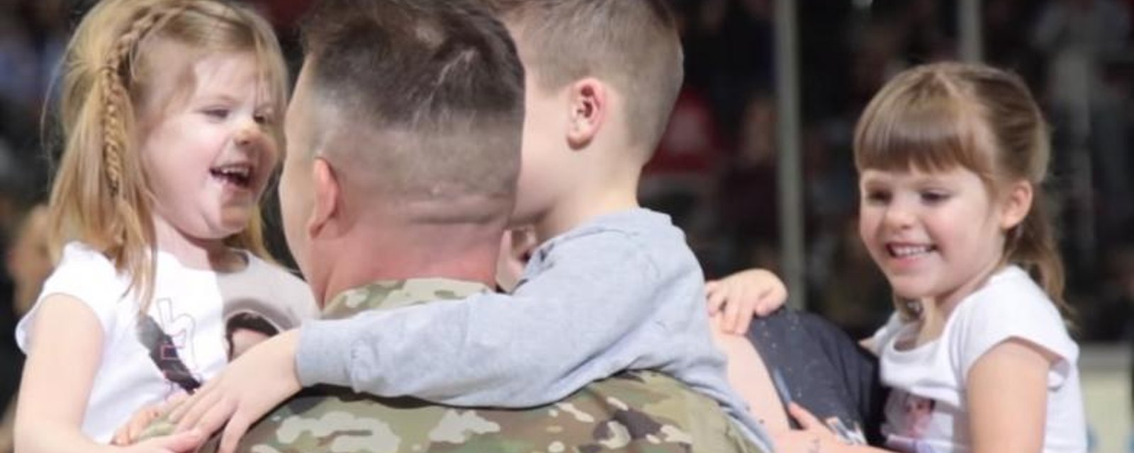Soldier disguises himself at hockey game to surprise his children.