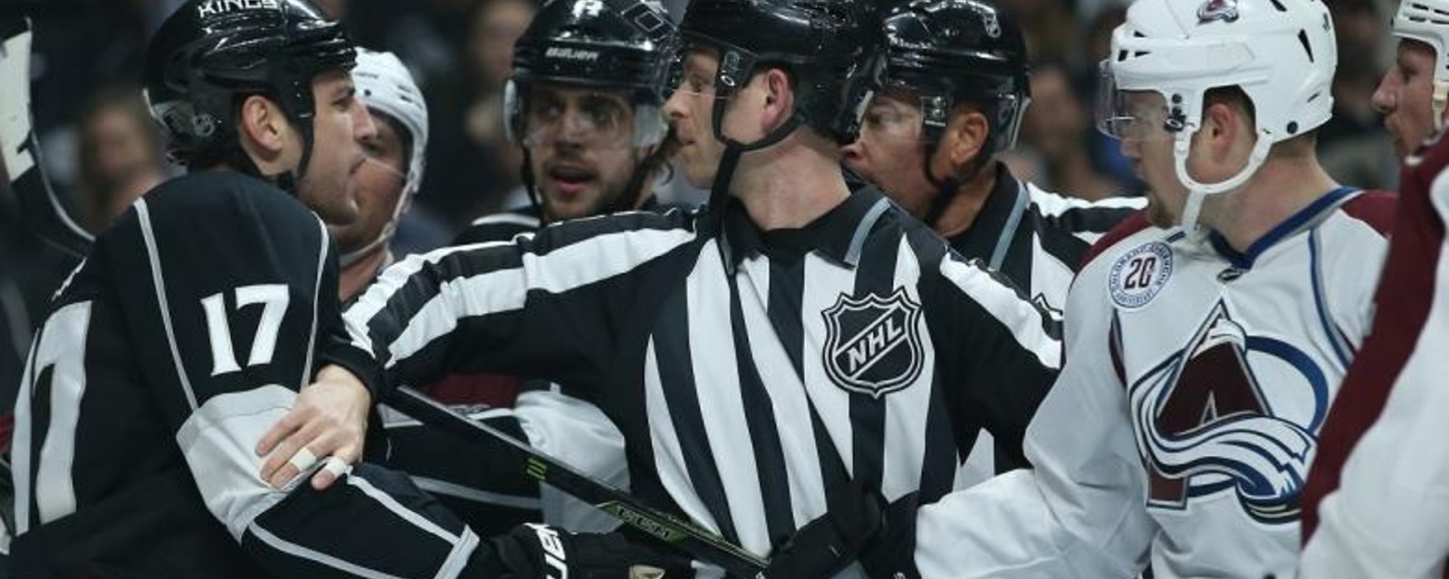 Milan Lucic punches a linesman right in the mouth.