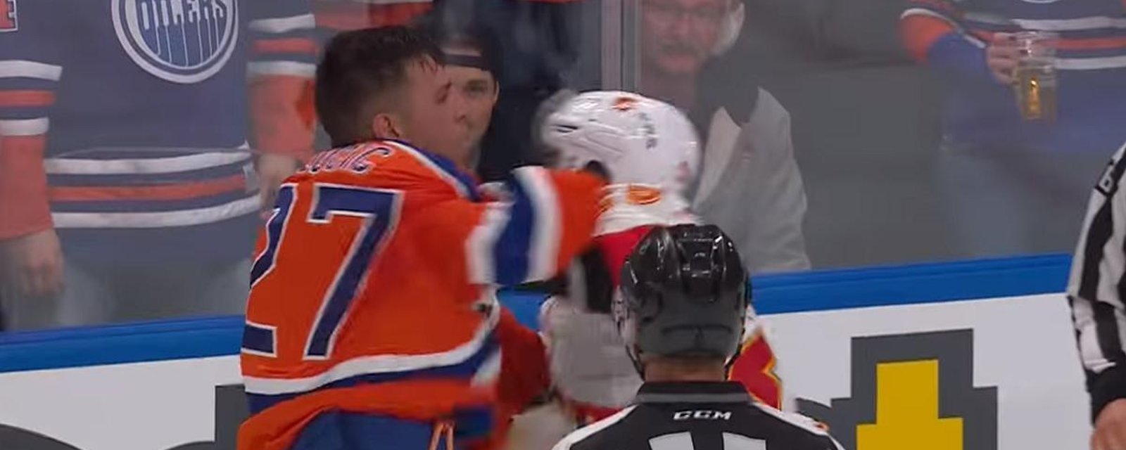 McDavid takes a hit in season opener and big bad Lucic comes to the rescue.