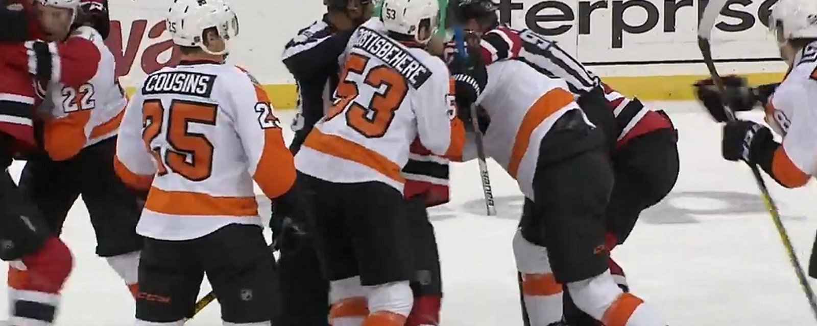 Devils go after the Flyers after collision at center ice leaves player injured.