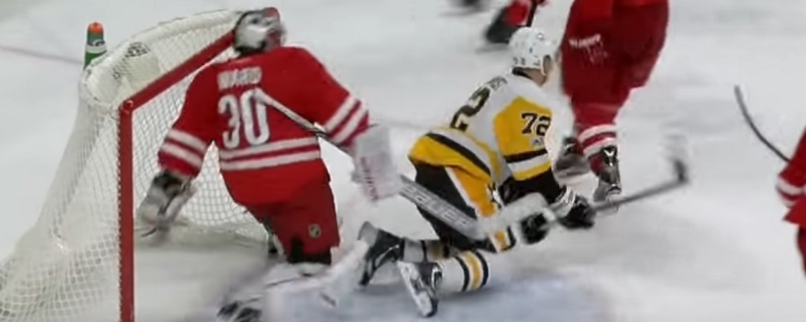 Cam Ward gets away with a slash to the back of Hornqvist's leg.